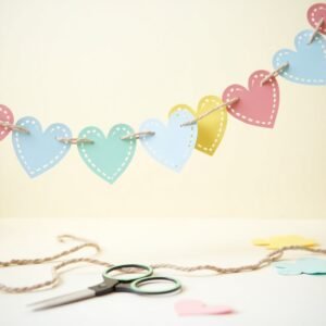 easy last minute Galentine’s Day decor DIY Heart Garlands Cut out paper hearts in different sizes